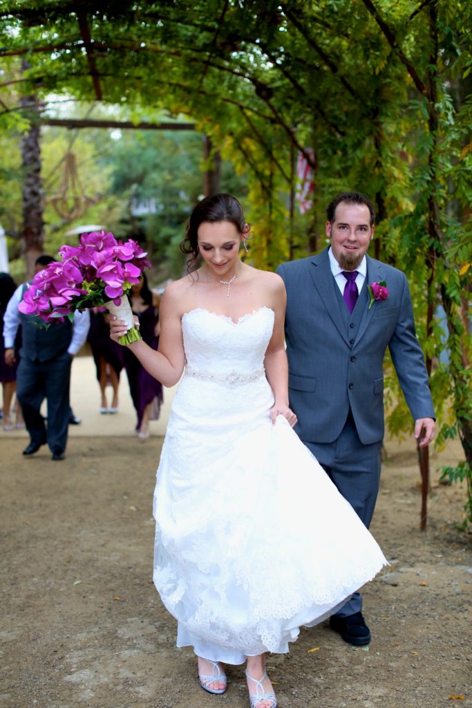 Rustic fall wedding at Calamigos Ranch, bride and groom portrait shot with purple bridal bouquet