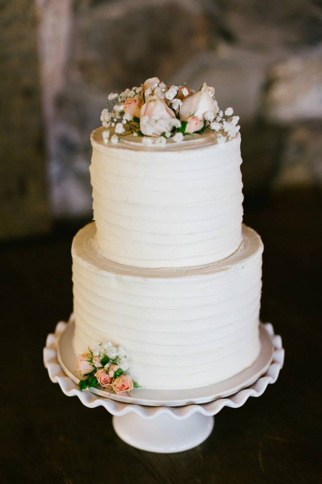Rustic and elegant wedding at Calamigos Ranch in the Redwood room, cake with rose detail