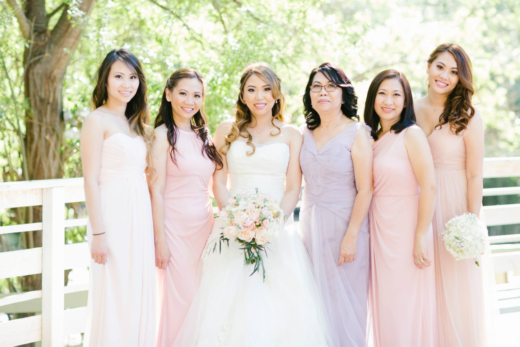 Rustic and elegant wedding at Calamigos Ranch in the Redwood room, bride and bridesmaid with mismatched blush dresses