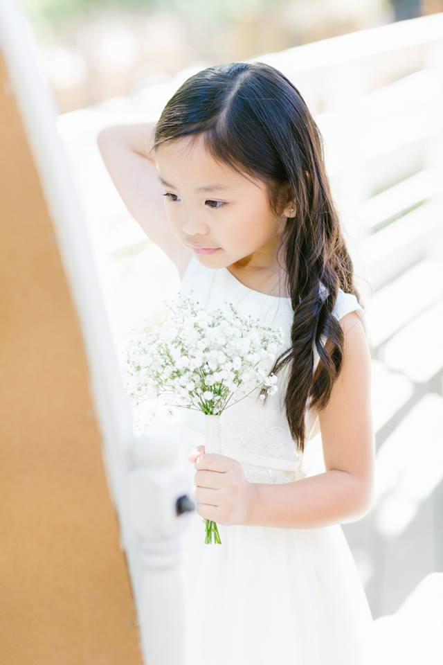 Rustic and elegant wedding at Calamigos Ranch in the Redwood room, flower girl with baby's breath bouquet