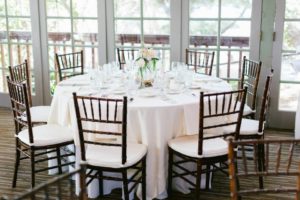 Rustic and elegant wedding at Calamigos Ranch in the Redwood room, reception with blush tablecloths and wood chiavari chairs