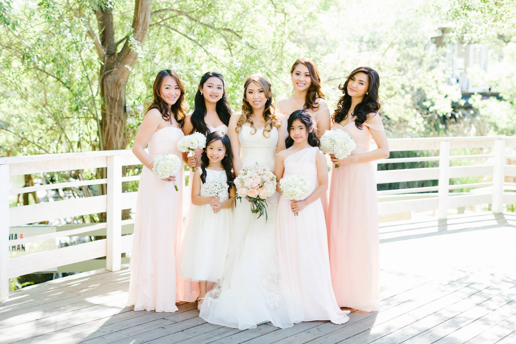 Rustic and elegant wedding at Calamigos Ranch in the Redwood room, bride with bridesmaids, mismatched blush bridesmaid dresses