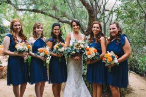 A garden wedding at Mermaid Mountain Inn, eucalyptus bouquets, blue bridesmaid dresses