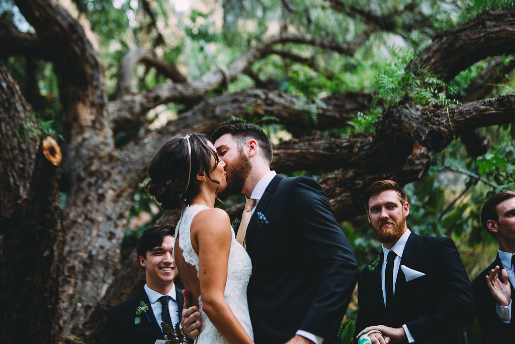 A garden wedding ceremony at Mermaid Mountain Inn, first kiss