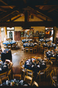 A garden wedding at Mermaid Mountain Inn, reception with dark blue tablescape