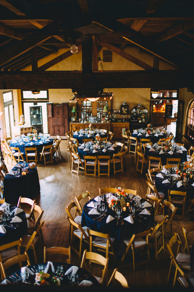 A garden wedding at Mermaid Mountain Inn, reception with dark blue tablescape