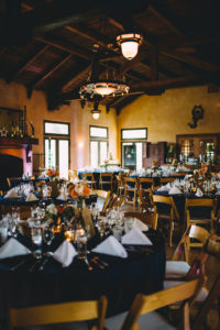 A garden wedding at Mermaid Mountain Inn, reception with navy blue tablescape