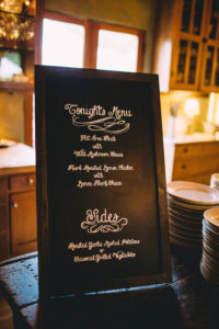 A garden wedding at Mermaid Mountain Inn, wedding menu sign