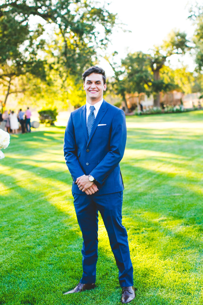 An intimate wedding at Triunfo Creek Vineyards, groom in blue suit