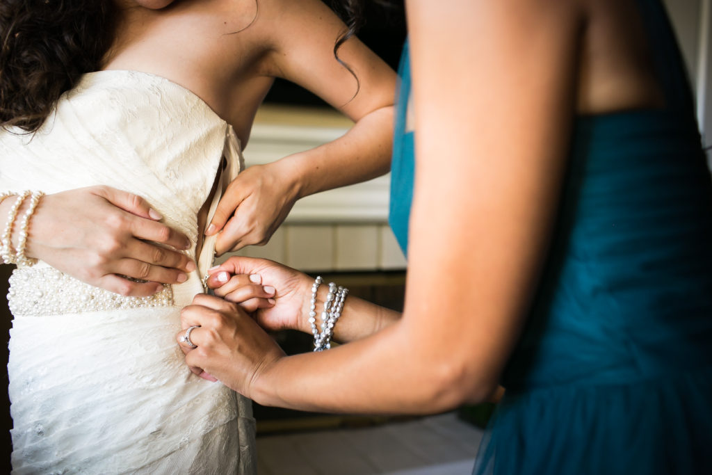 Classic and vintage wedding at Calamigos Ranch, bride getting dressed with mom