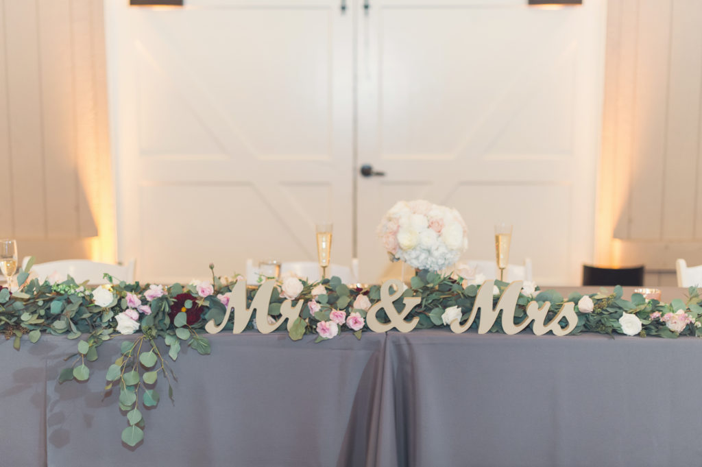 sweetheart table at this soft and romantic wedding at strawberry farms golf course