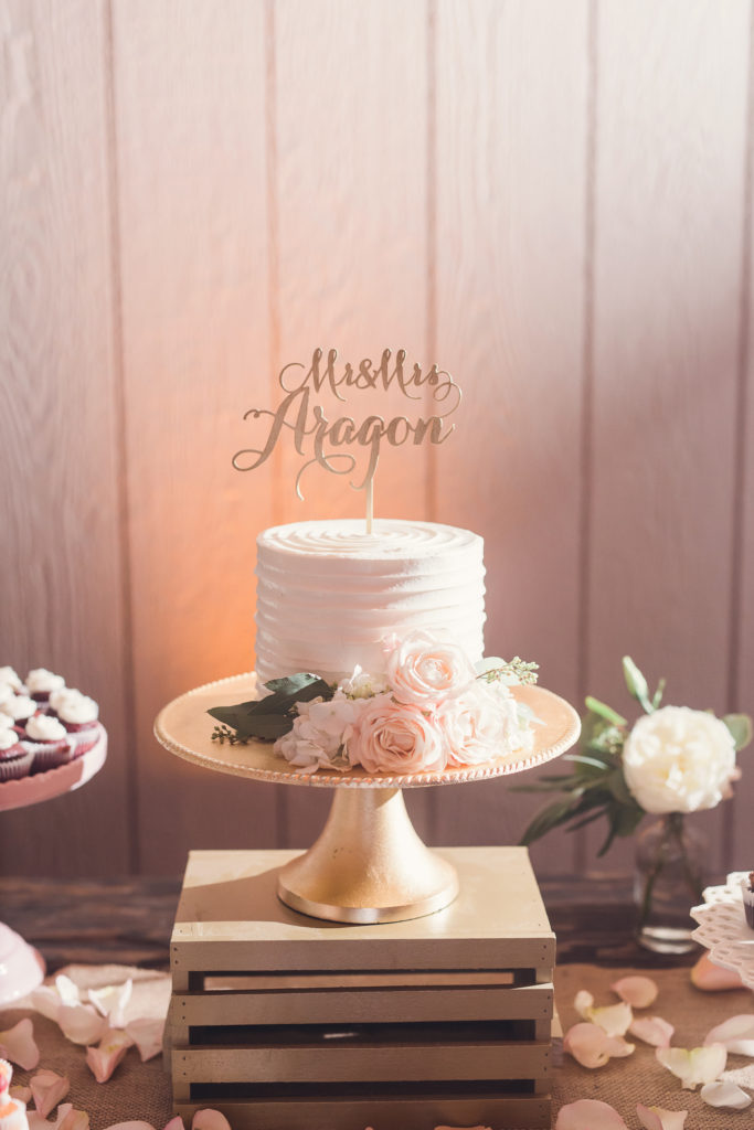 simple wedding cake with pink flowers