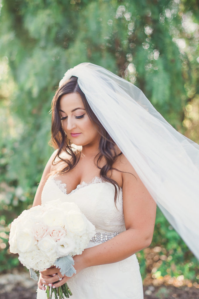 bride in long veil at this soft and romantic wedding at strawberry farms golf course