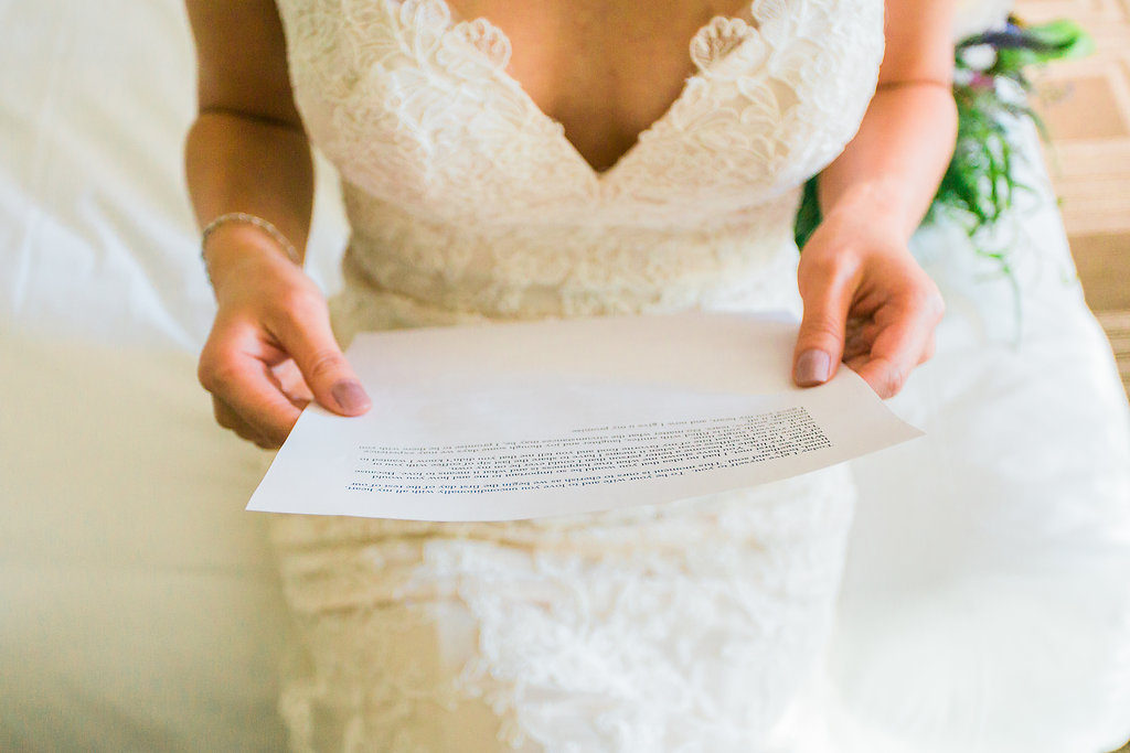 Modern and Chic wedding at Garland Hotel, bride reading letter from groom