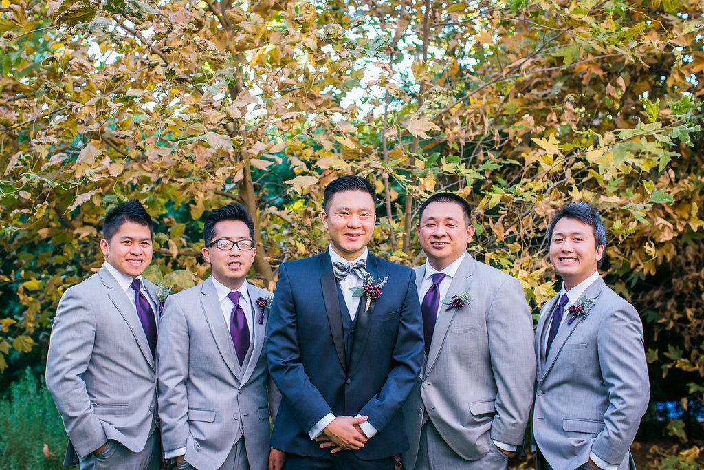 Modern and Chic wedding at Garland Hotel, groom and groomsmen wearing purple ties