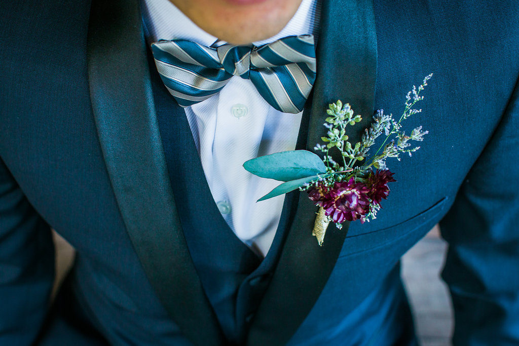 Modern and Chic wedding at Garland Hotel, groom in blue suit and purple boutonniere