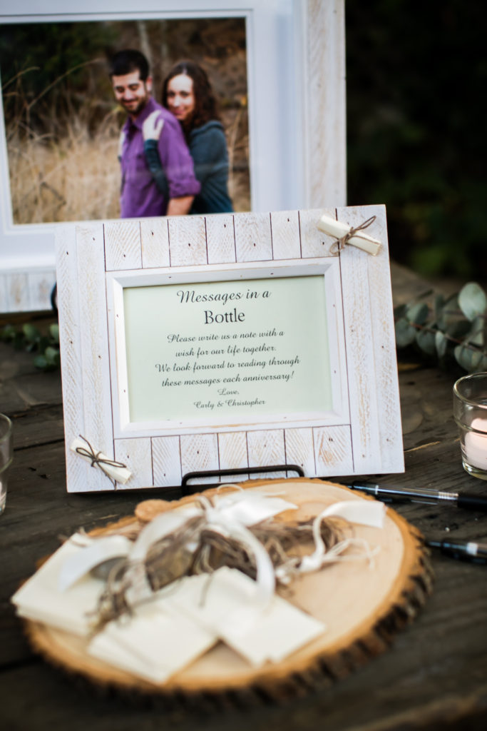 Classic and vintage wedding at Calamigos Ranch, welcome table with message in a bottle guest book