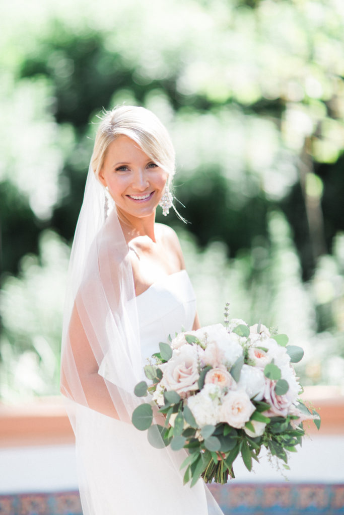 Rancho Las Lomas wedding, bride wearing strapless gown, long chapel veil and white bridal bouquet