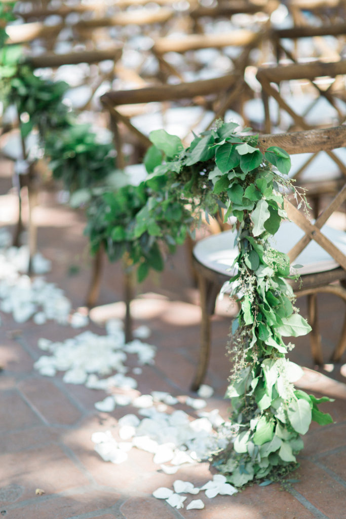 Rancho Las Lomas wedding ceremony, petal lined aisle with long garland