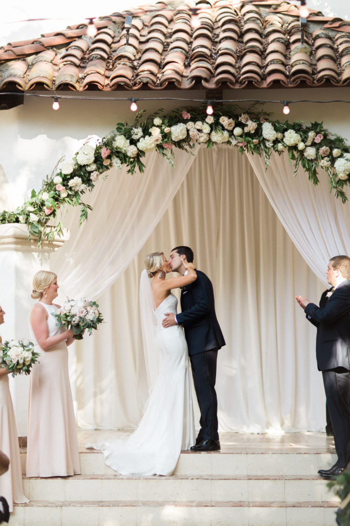 Rancho Las Lomas wedding ceremony, bride and groom first kiss