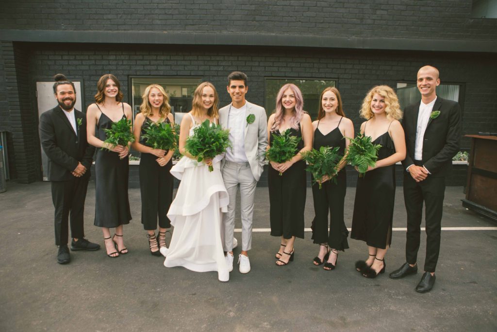 Pantone Color of 2017 inspired minimalist wedding at Hubble Studio in downtown Los Angeles, modern bride and groom, simple greenery bouquet and boutonniere, wedding party photo with black groomsmen suits and black bridesmaid dresses