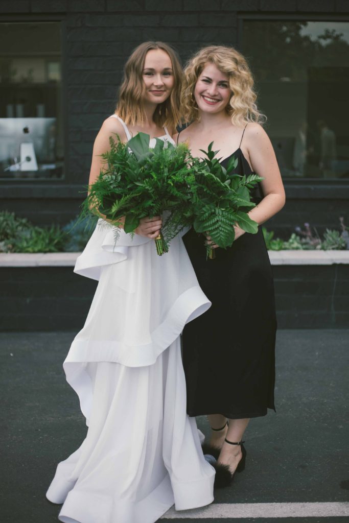 Pantone Color of 2017 inspired minimalist wedding at Hubble Studio in downtown Los Angeles, modern bride and groom, simple greenery bouquet and boutonniere, wedding party photo with black groomsmen suits and black bridesmaid dresses