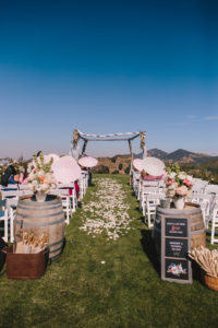 Saddlerock Ranch wedding ceremony site at the dome with flower petals down the aisle