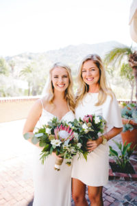 bride with bridesmaid in white dress