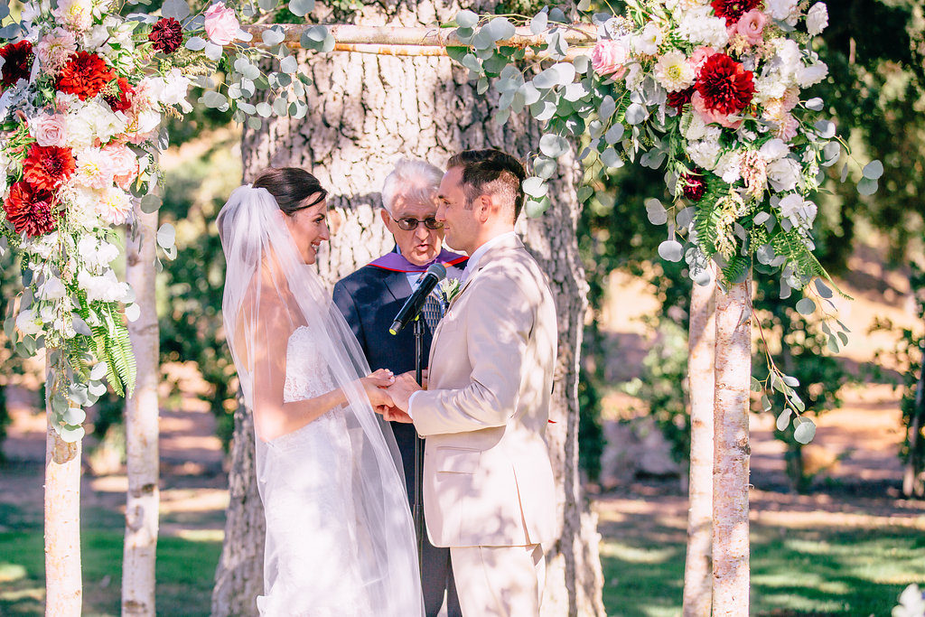 Triunfo Creek Vineyards Wedding Malibu vows arch ceremony