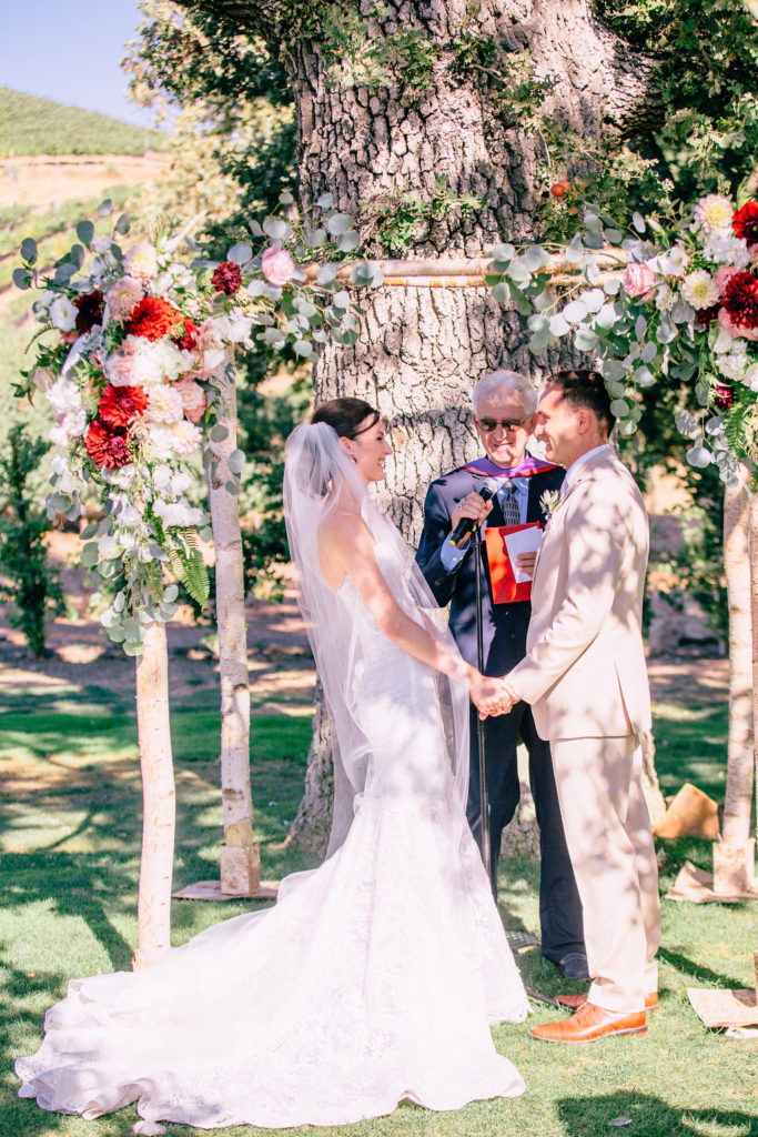 Triunfo Creek Vineyards Wedding Malibu Ceremony vows under the arch