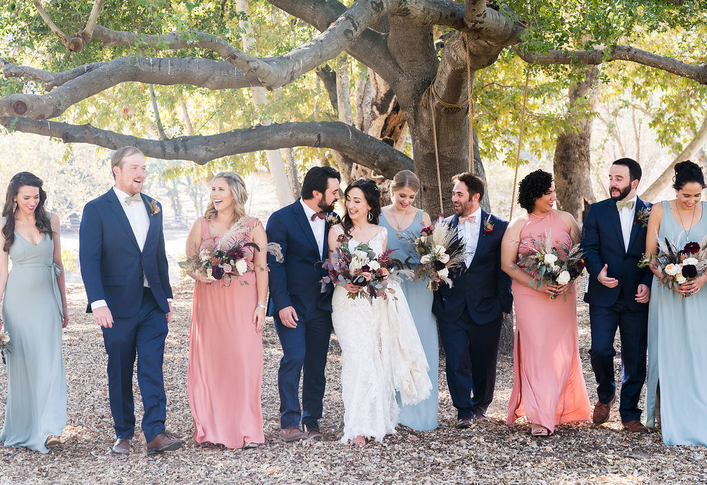 Bridal party photos with Show Me Your Mumu pink and blue bridesmaids dresses and navy groomsmen tuxes