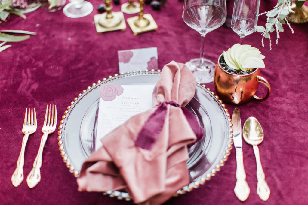 Wedding dinner place setting from Signature Party Rentals with velvet linens from La Tavola at Rancho Las Lomas