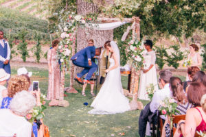 A summer wedding at Triunfo Creek Vineyards, Jewish wedding ceremony with a birchwood chuppah and florals at Triunfo Creek Vineyards in Malibu