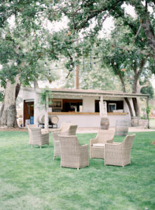 Bar and cocktail area at Triunfo Creek Vineyards with wicker chairs