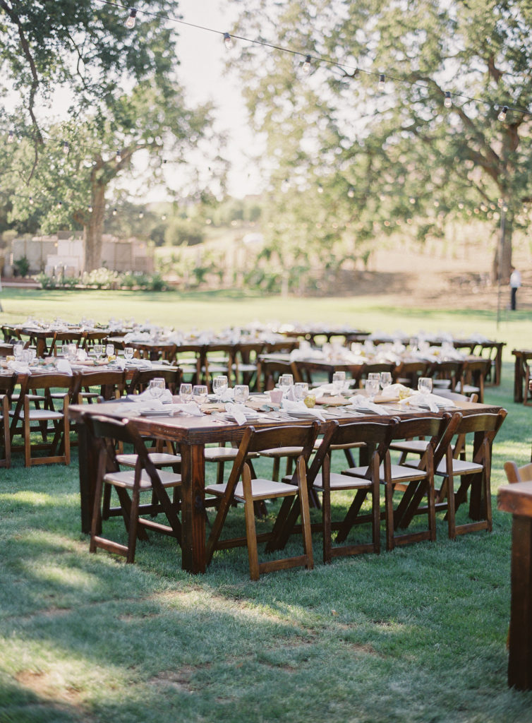 Wooden farm tables at a wedding reception at Triunfo Creek Vineyards