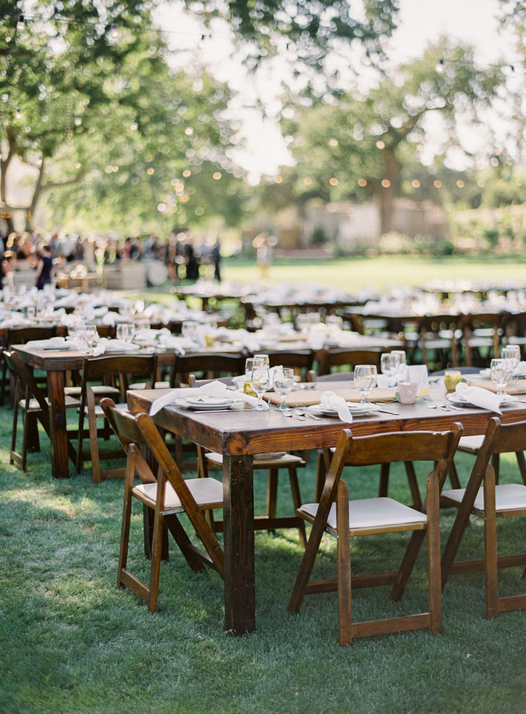 Wooden farm tables at a wedding reception at Triunfo Creek Vineyards