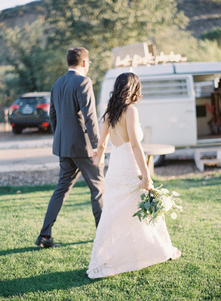 Bride and Groom photos at Triunfo Creek Vineyards Wedding with a white floral bouquet