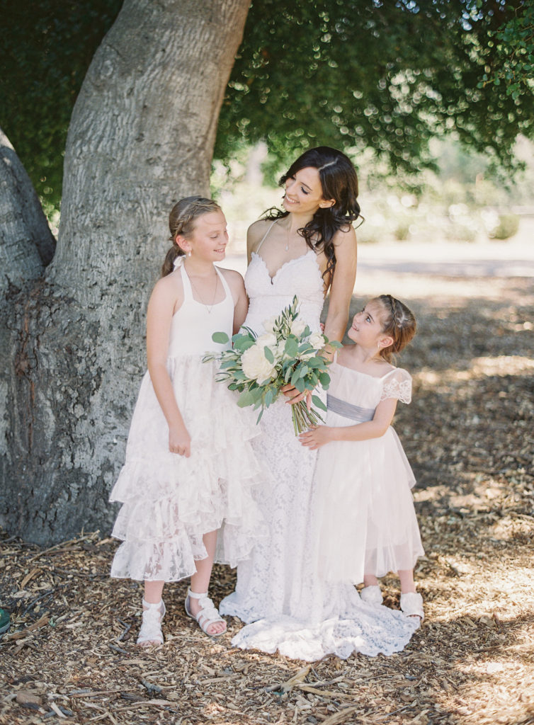 Bride and flower girls in white dresses