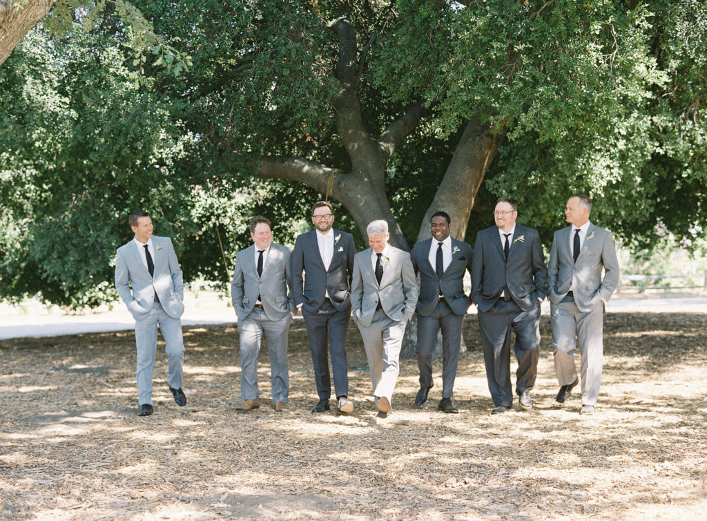 Groomsmen in shades of grey suits at Triunfo Creek Vineyards