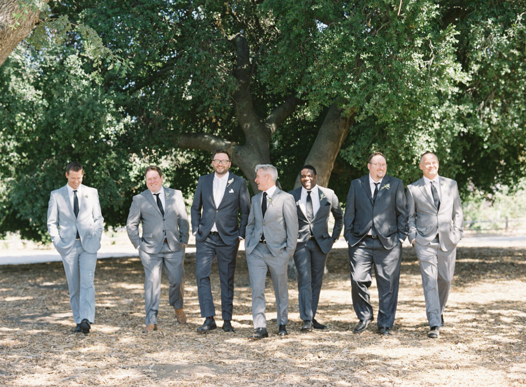 Groomsmen in shades of grey suits at Triunfo Creek Vineyards