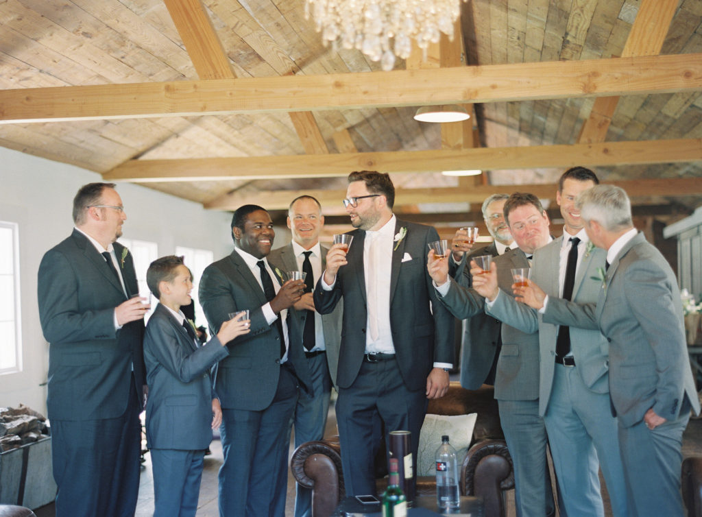 Groom and groomsmen pre-ceremony drinks