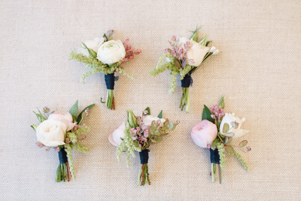 blush and navy boutonniere for groomsmen