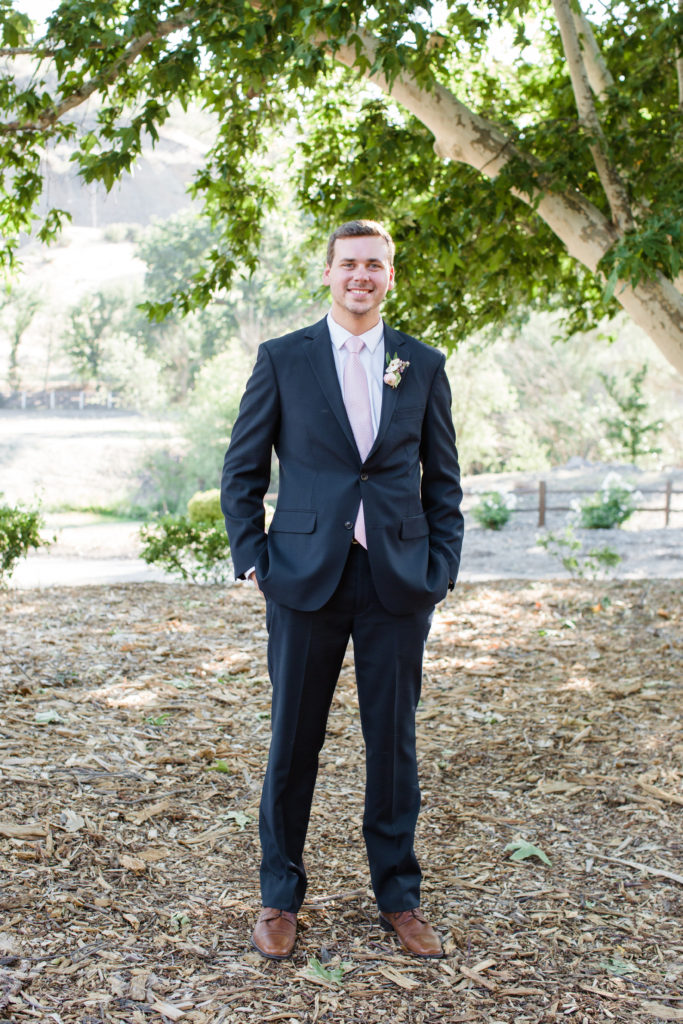 navy and blush grooms suit