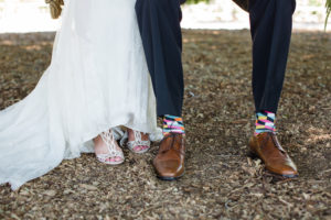 Triunfo Creek Vineyards wedding, groom wearing multicolored socks