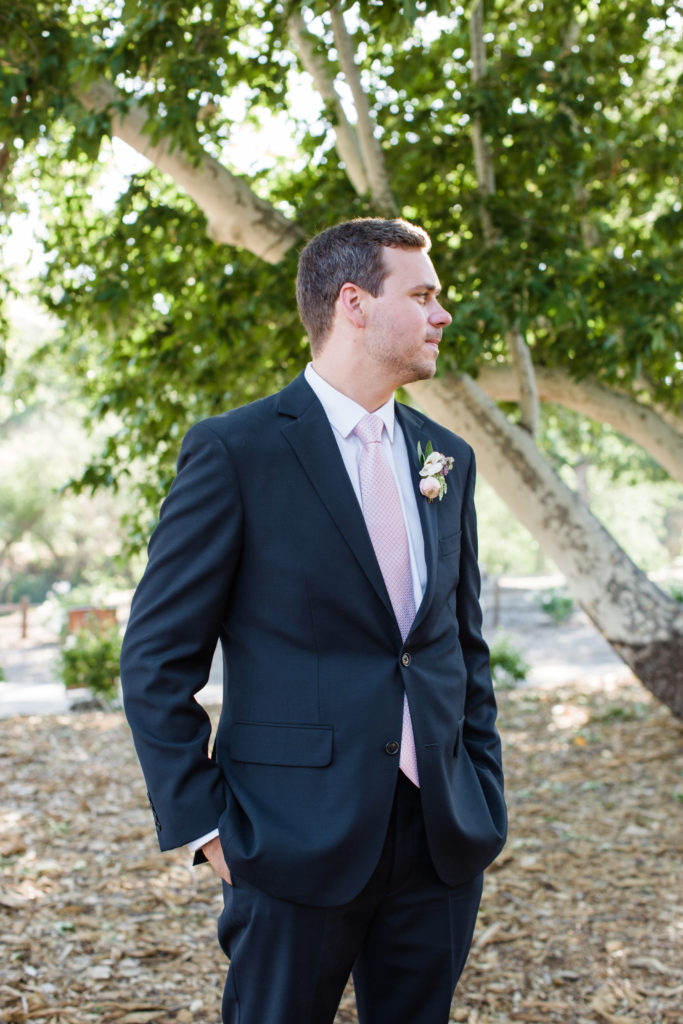 navy and blush groom suit