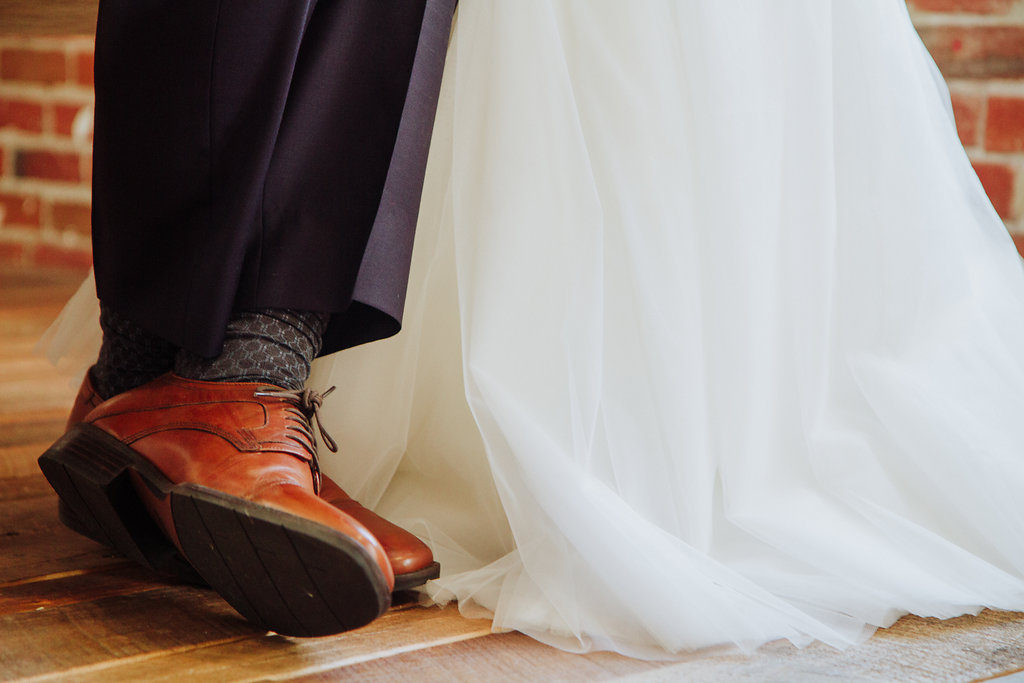 shoe shot, wedding dress with brown groom shoes