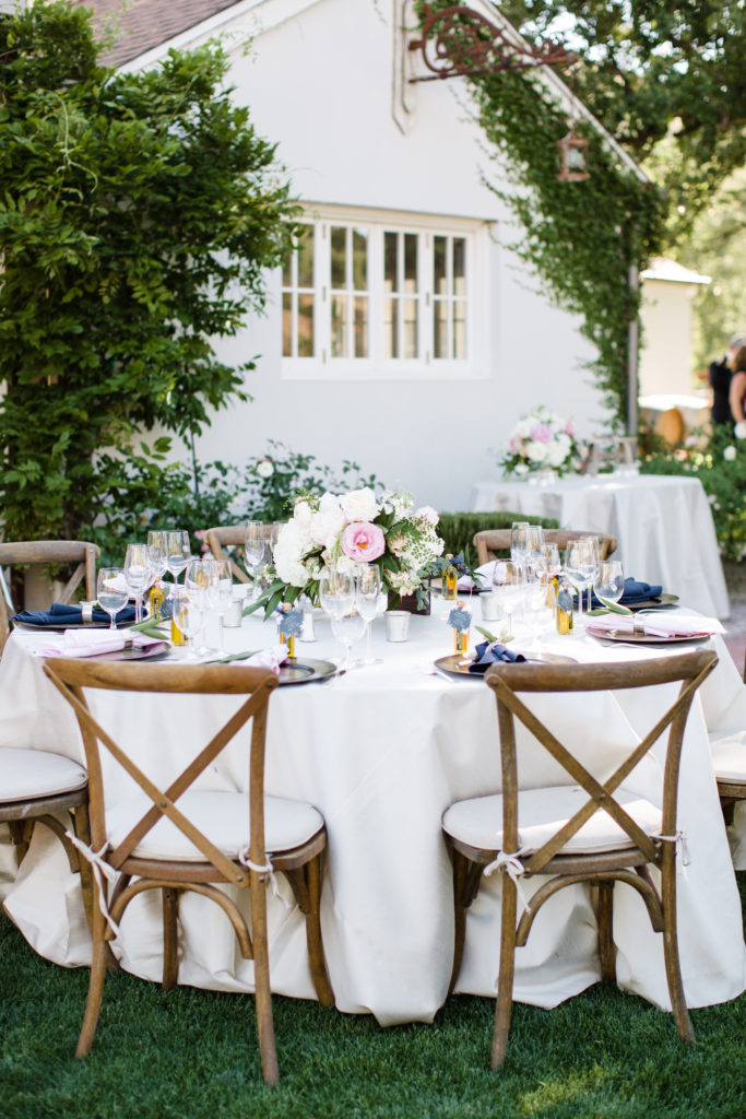 Triunfo Creek Vineyards wedding reception, blush and navy tablescape with wooden cross chairs