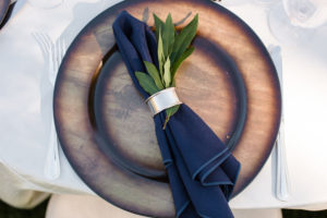 Triunfo Creek Vineyards wedding reception, blush and navy tablescape with wooden chargers