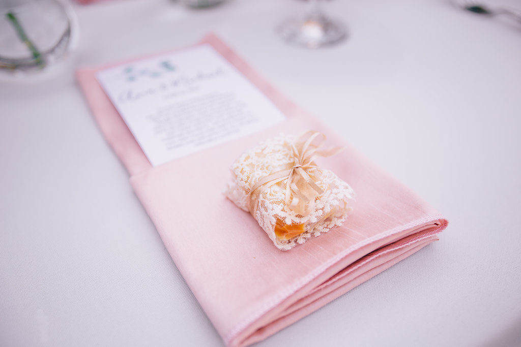 blush napkin fold, guest favor box at wedding
