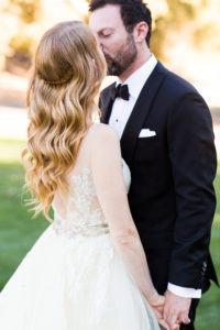 Royal Inspired Vineyard Wedding at Triunfo Creek Vineyards, first look, bridal hair with loose waves and gold hair accessory